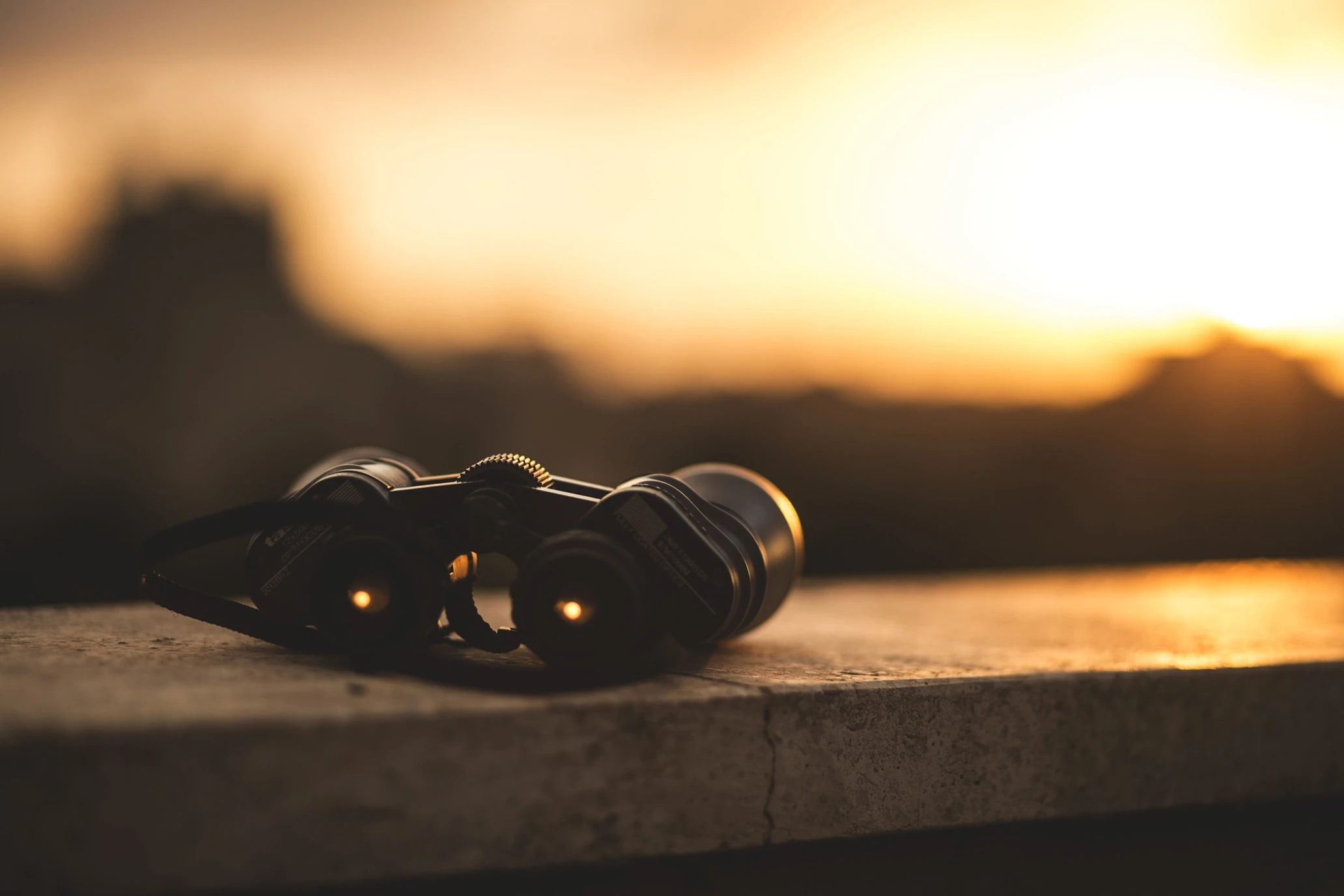 Binoculars sitting on a ledge