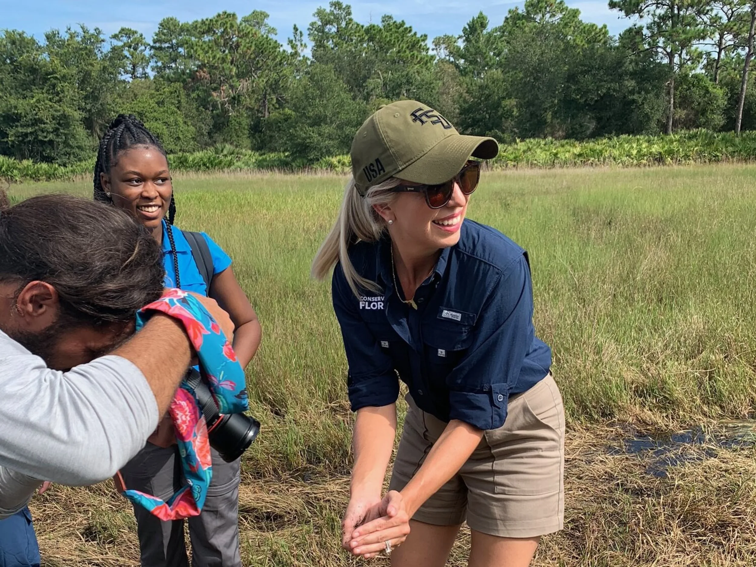 Two women examine wildlife at a Florida preserve containing 149 acres of critical Florida scrub habitat and 60 acres of scrubby flatwoods.