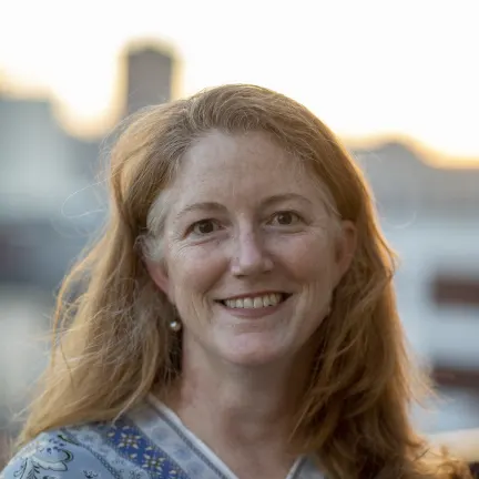 Portrait photo of a smiling Jennifer Miller Herzog 