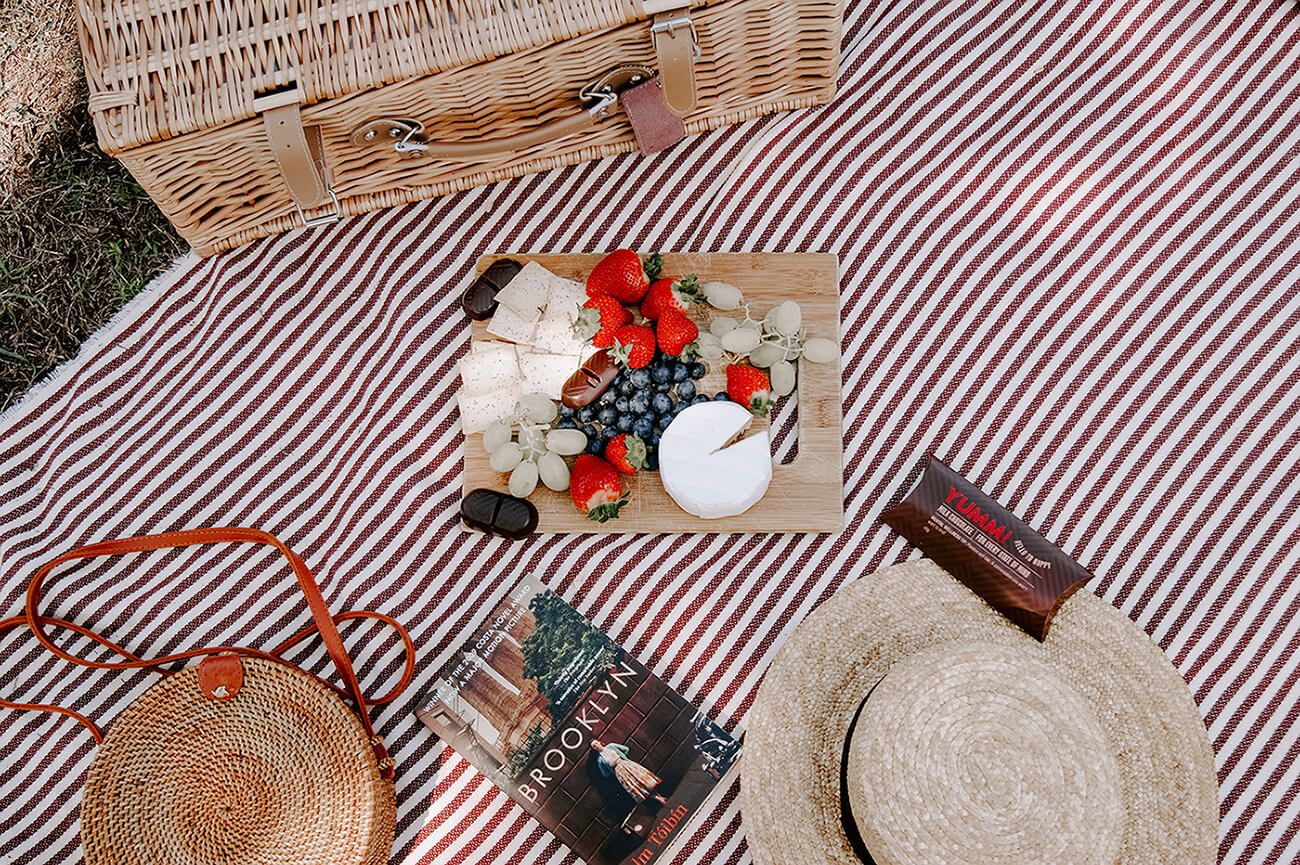 picnic image with fruit and cheese board