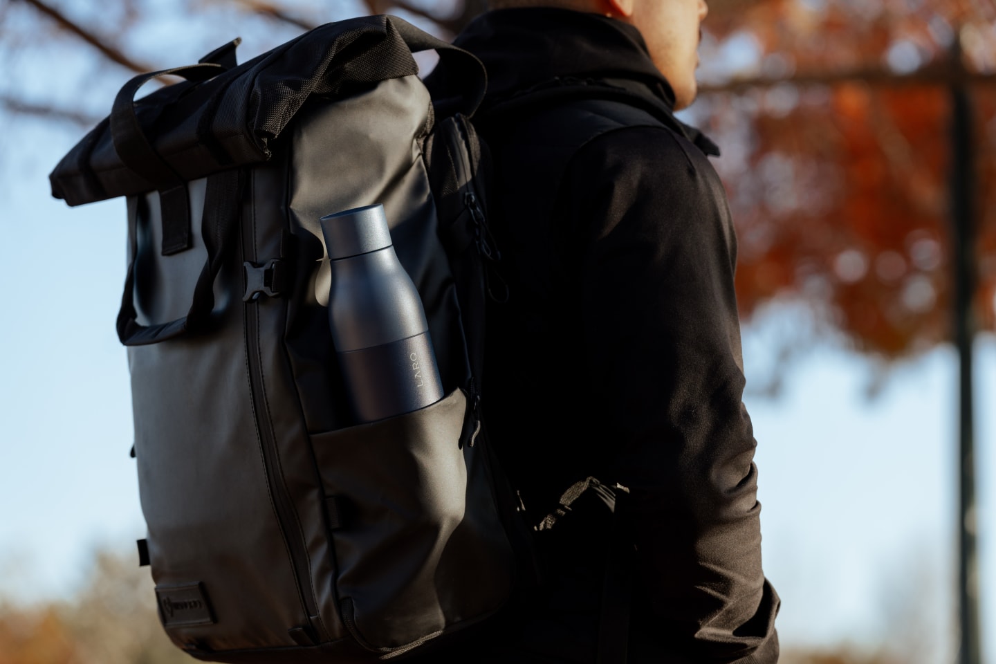 Man carying LARQ PureVis 1 bottle in a bag