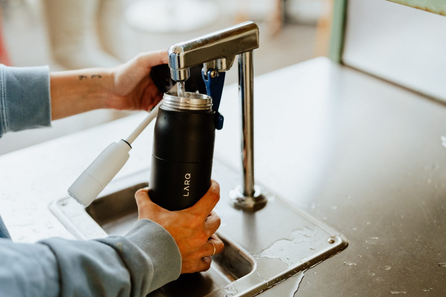 Man filling up PureVis 2 Bottle