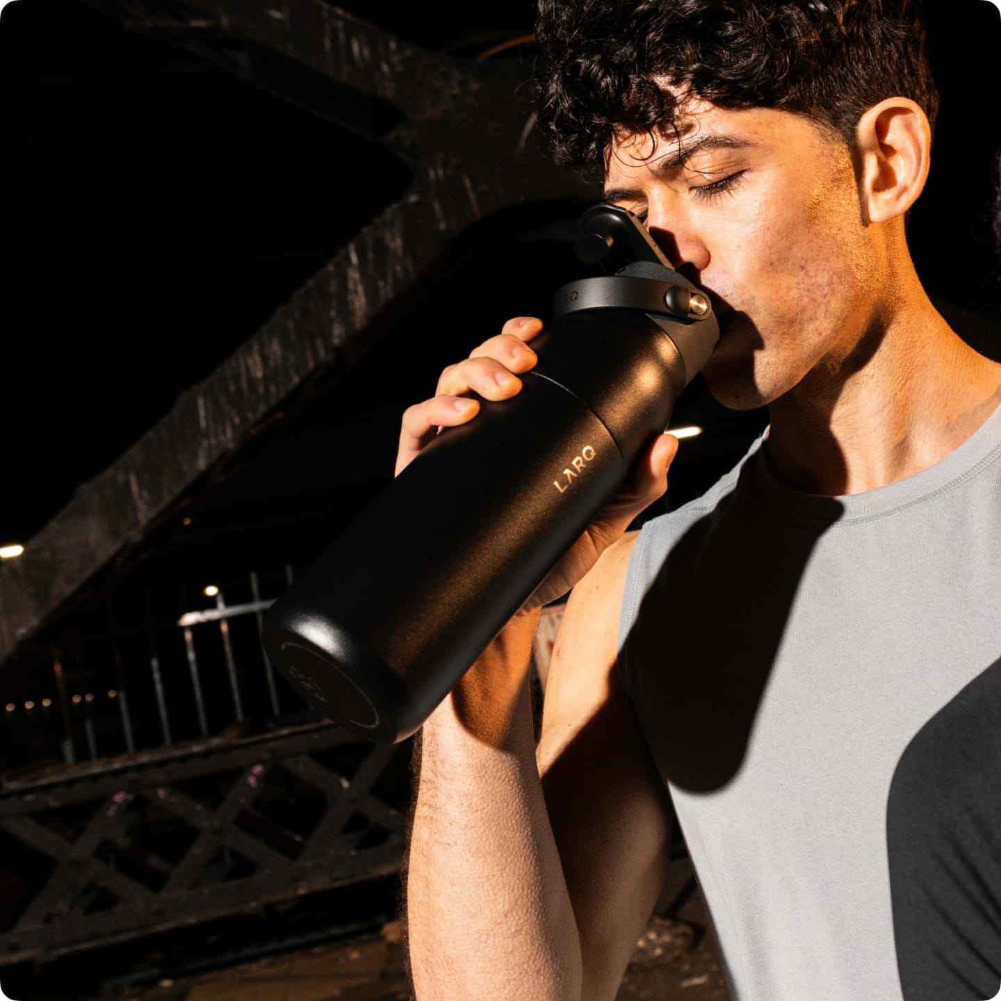 Man drinking from PureVis 2 Bottle