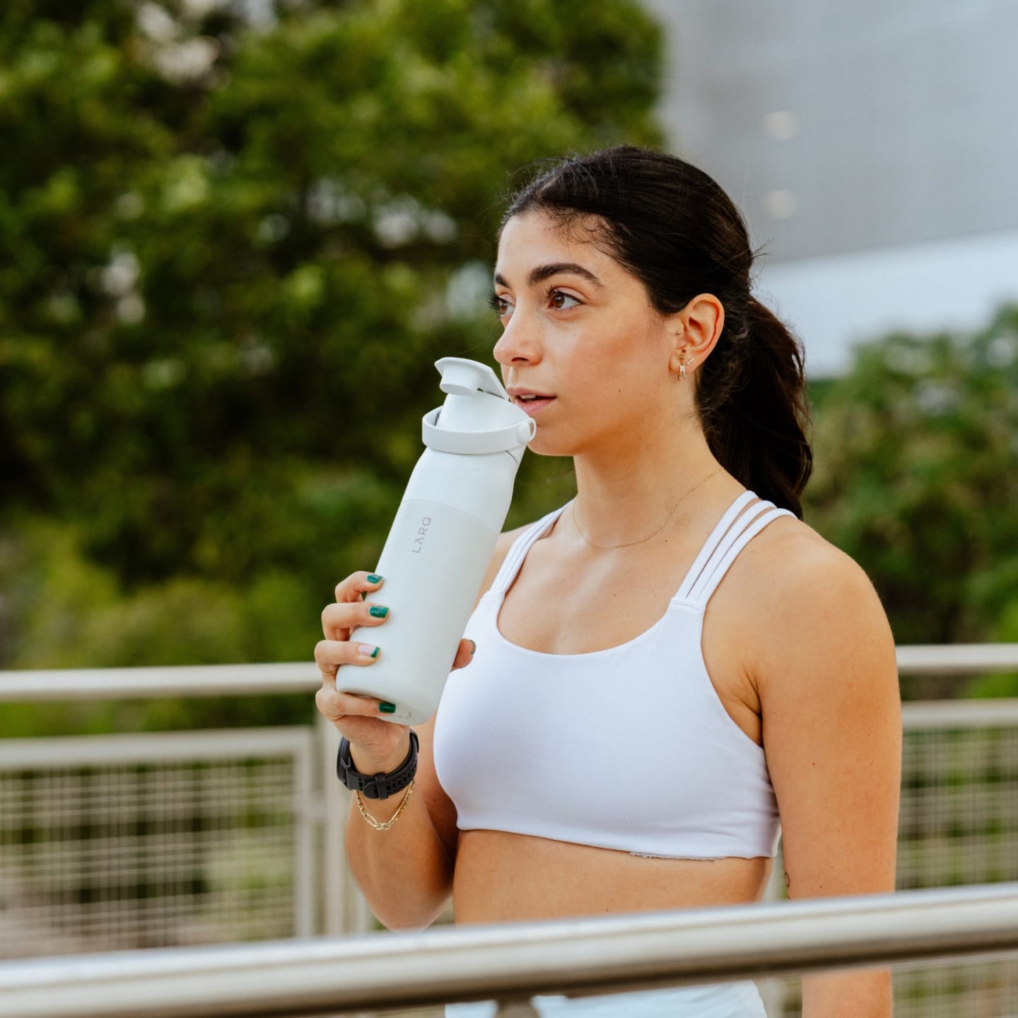 Man drinking water from Larq bottle swig top