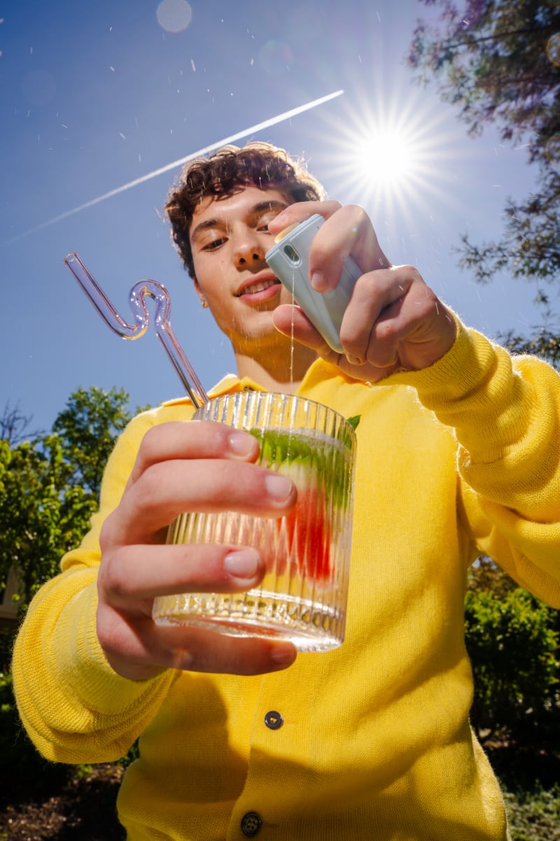 Man pouring cūva into a glass