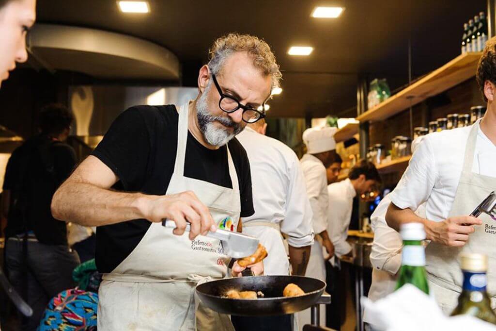 massimo bottura - italian michelin star chef cooking in food for soul kitchen