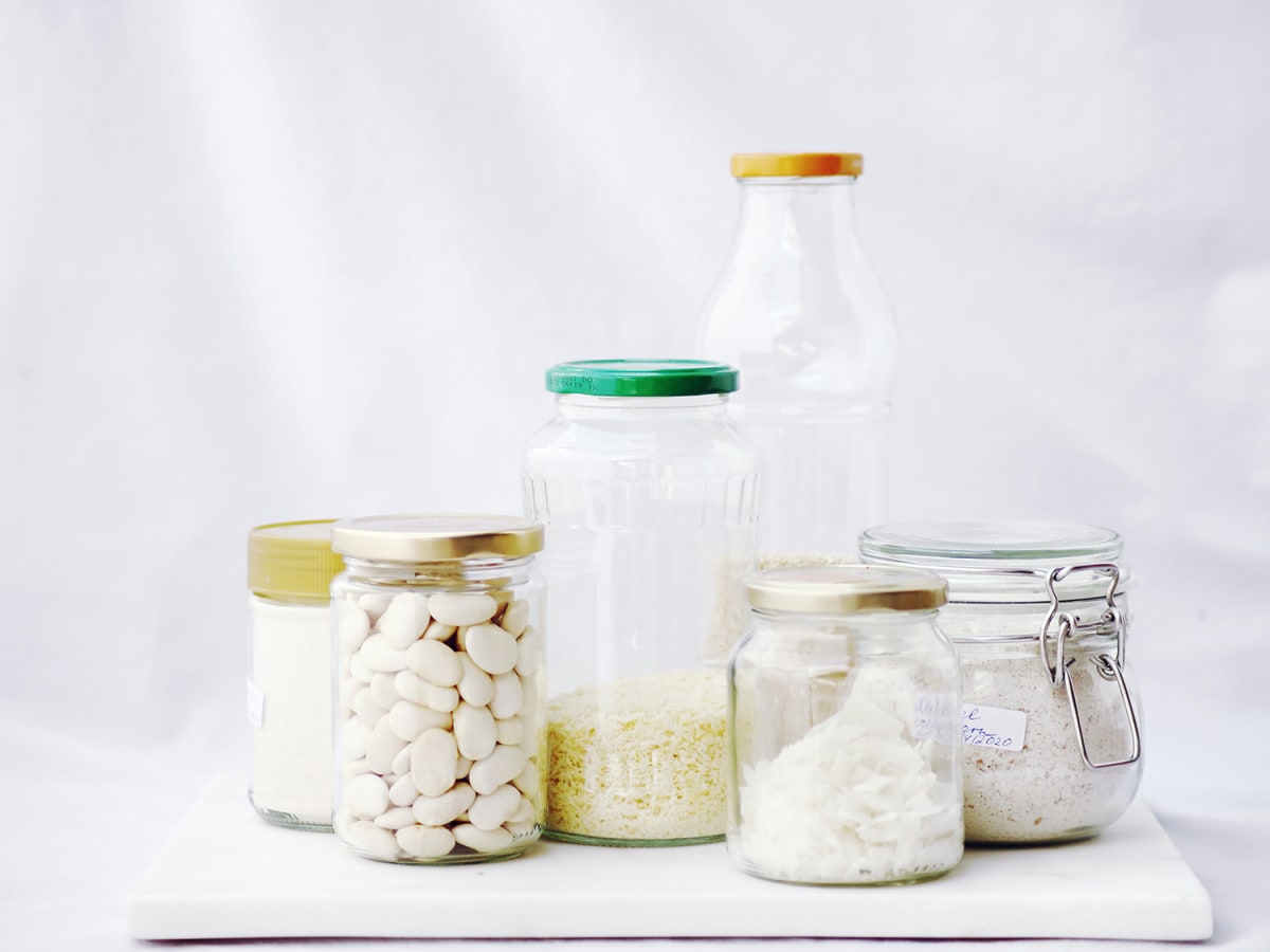 kitchen ingredients inside repurposed glass jars