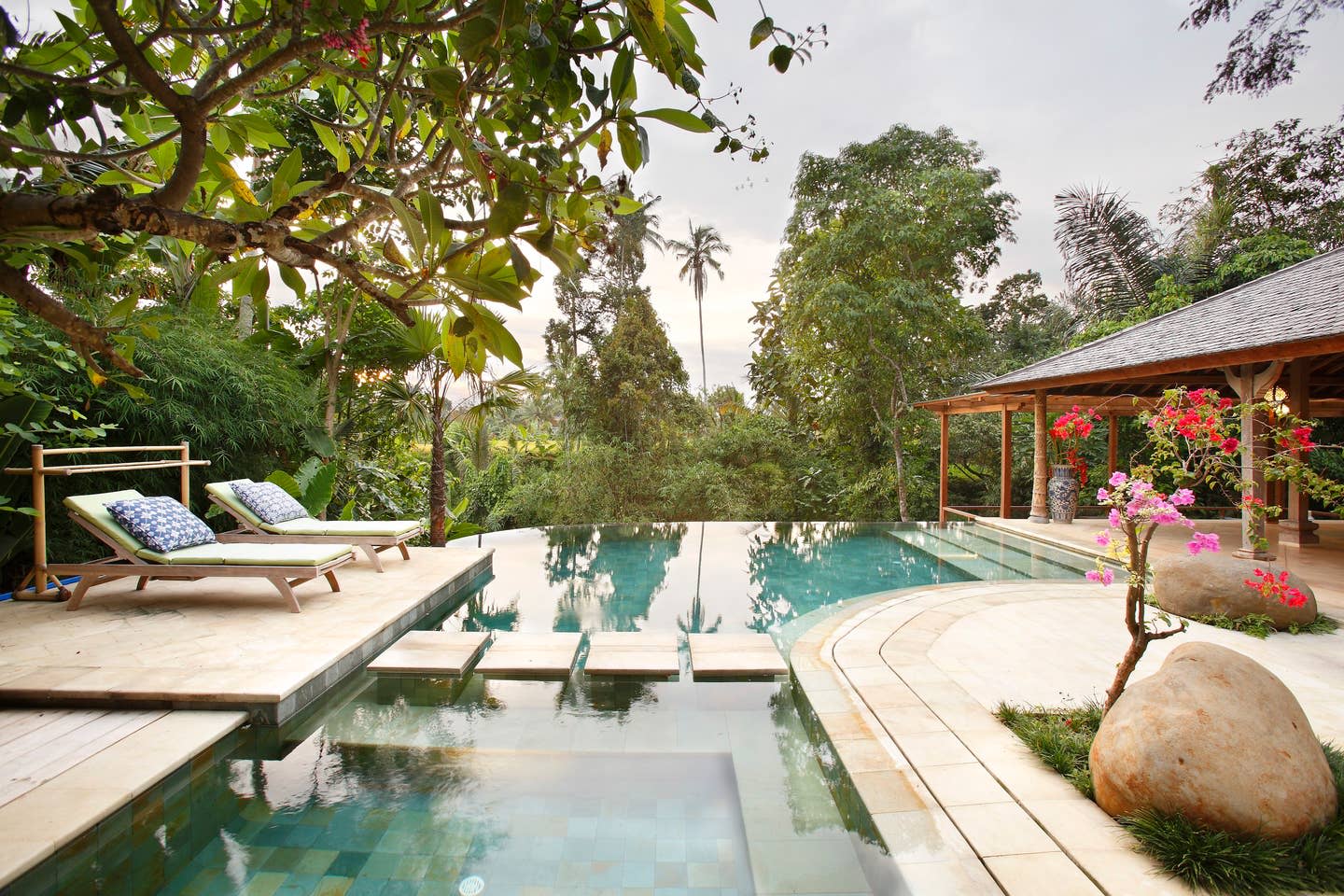 earth house villa in ubud, indonesia with outdoor pool and tropical view