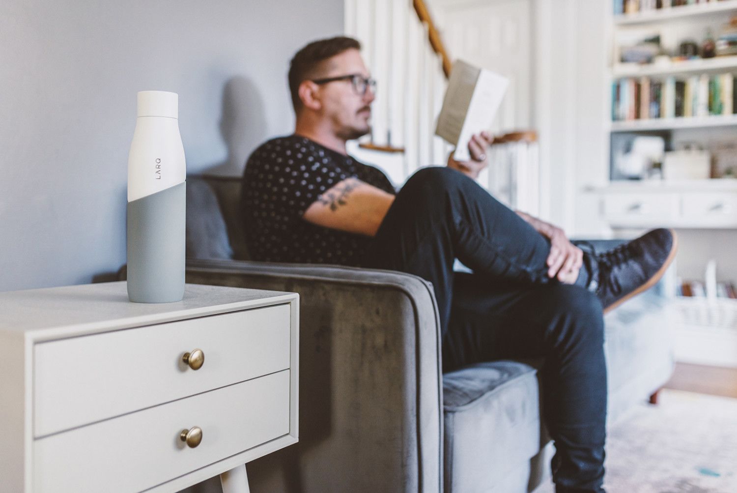 Tim Landis reading with LARQ Bottle Movement Terra Edition in White/Pebble