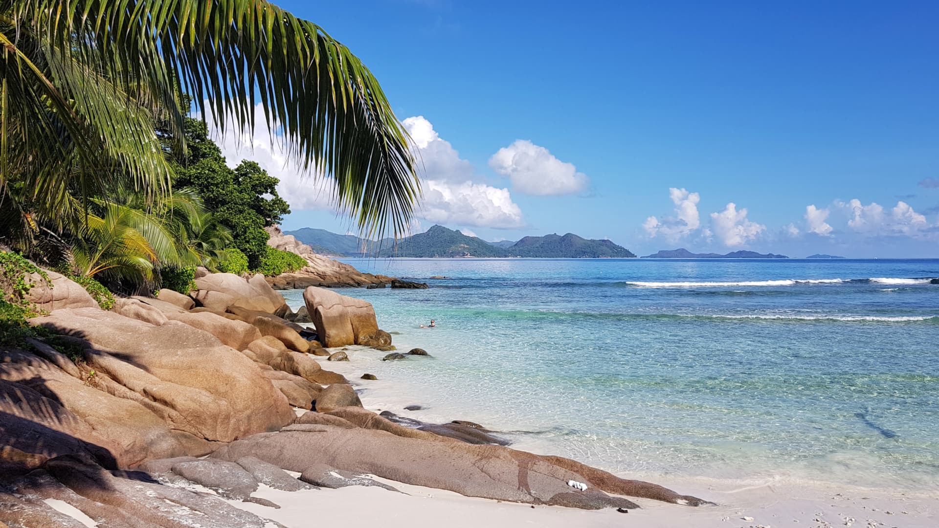 A stunning image of a Seychelles beach, with an AR overlay showcasing the potential for immersive and interactive experiences