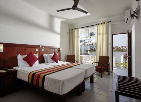 Hotelzimmer mit Mountainbike im Coral Sands