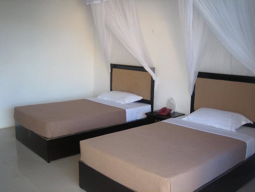 

Catania - Uroa - Coconut Tree Village Beach Resort