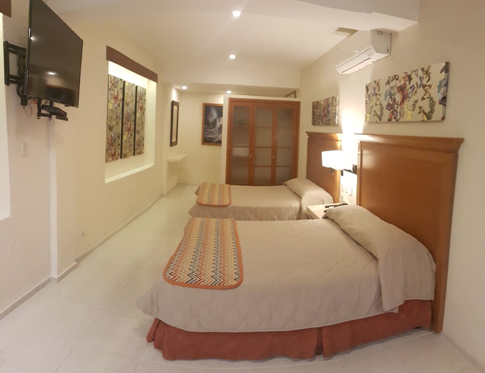 

Milano - Cancun - Hotel y Suites Nader