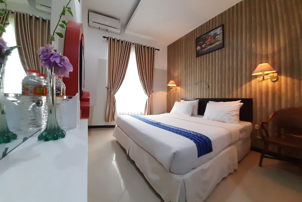 

Roma - Banjarmasin - Queen City Hotel