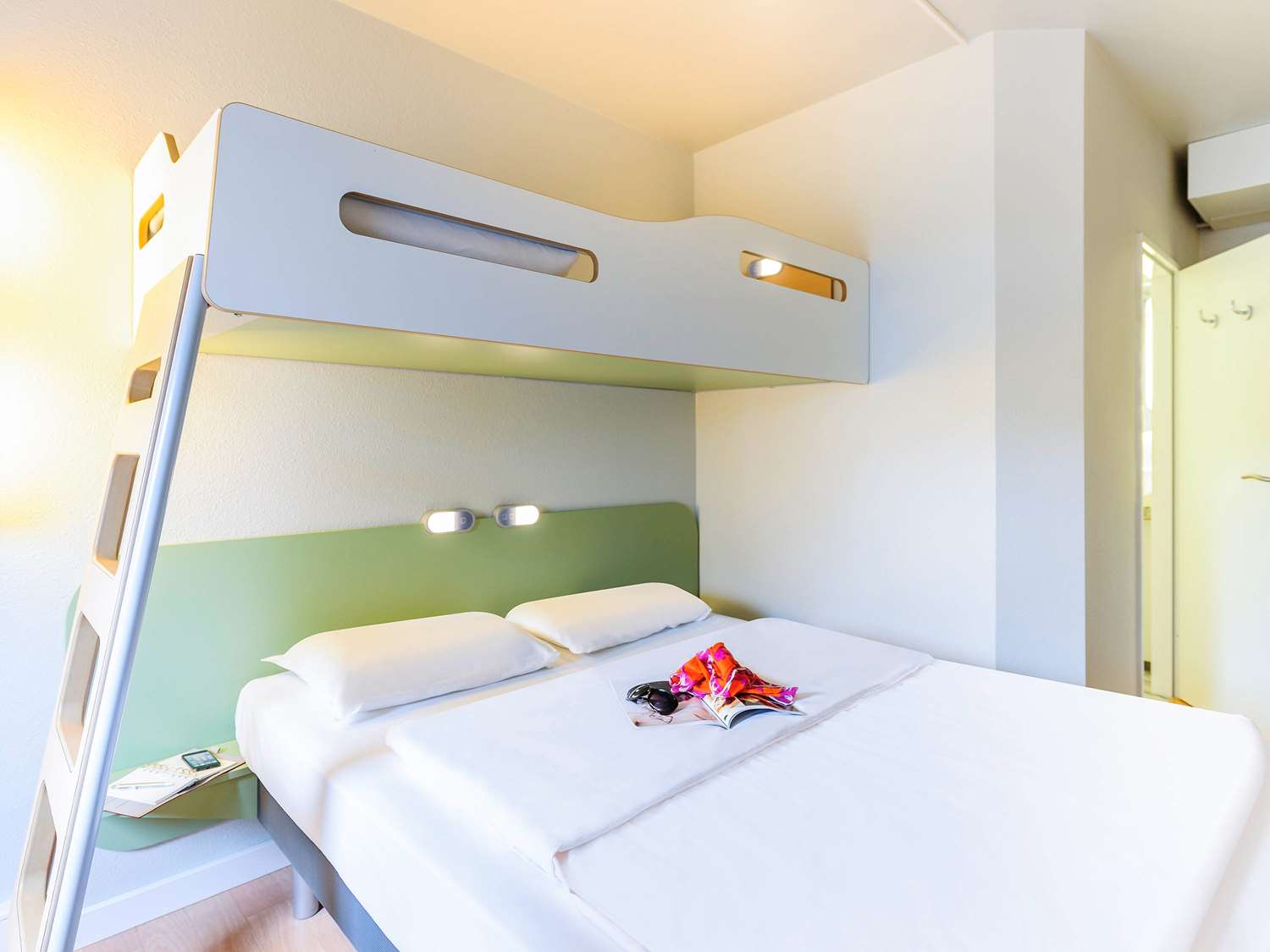 Standard room with a double bed and a loft bed
