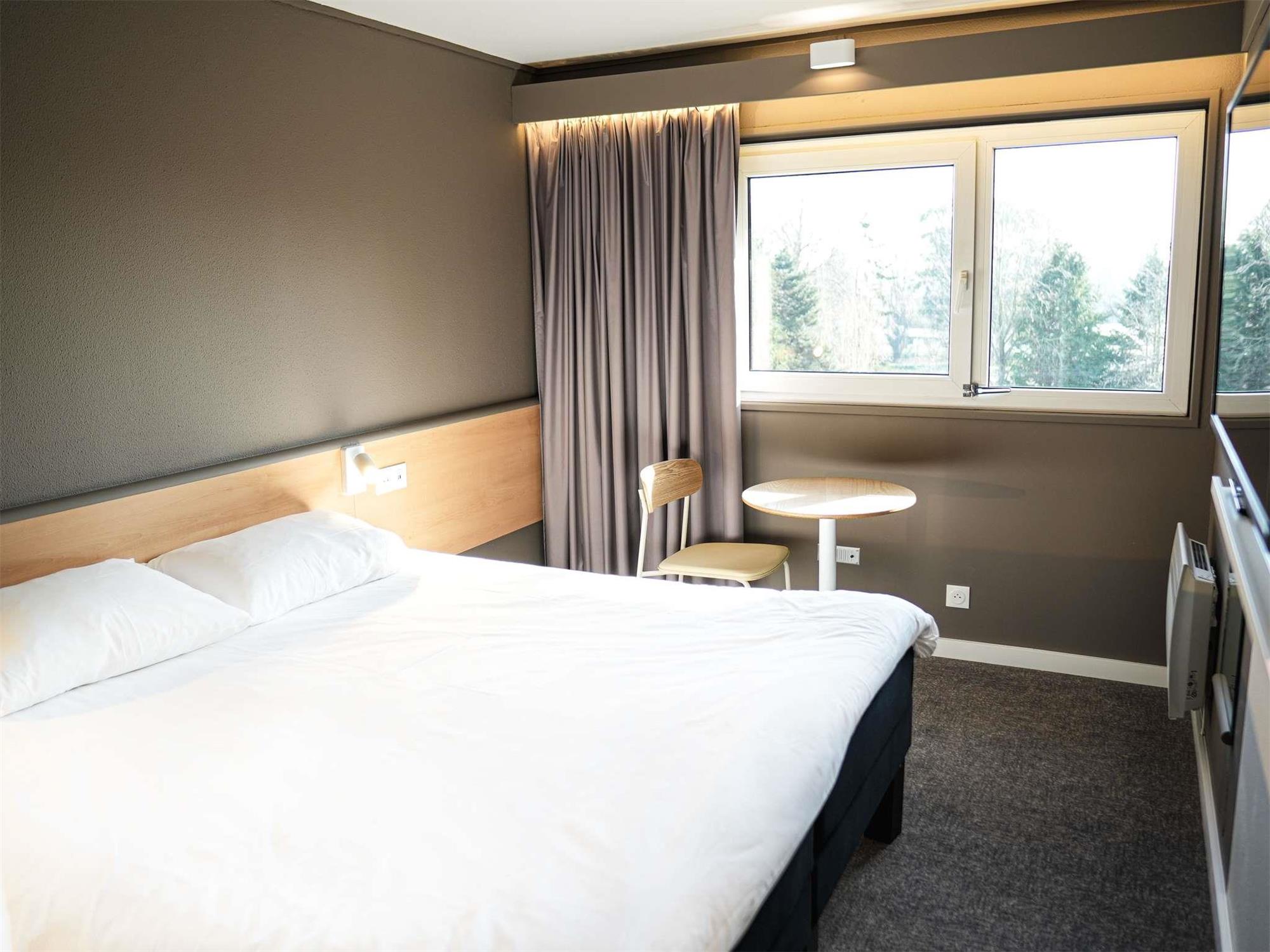 Renovated room with double bed