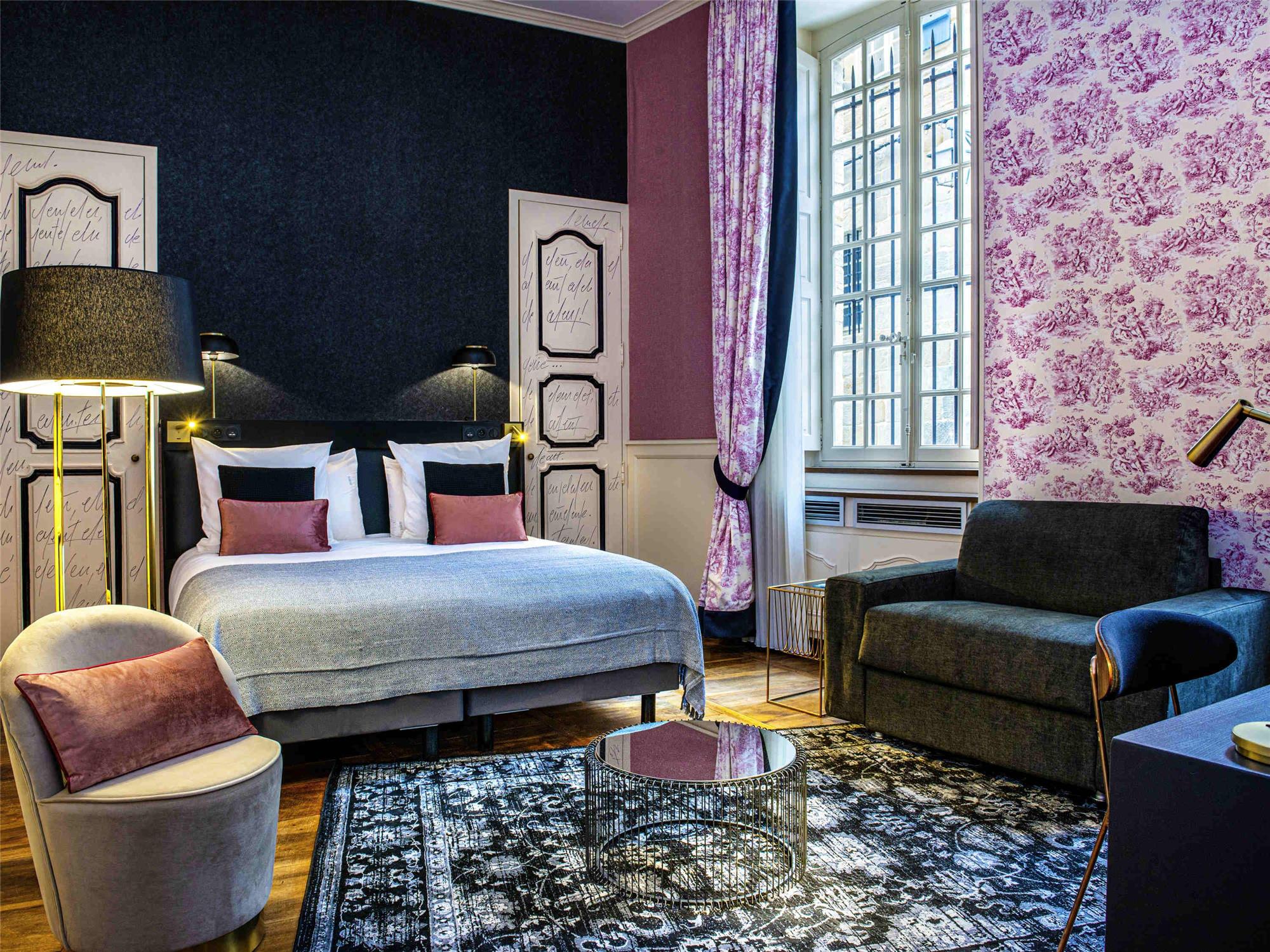 Privilege room - a double bed and a fireside chair