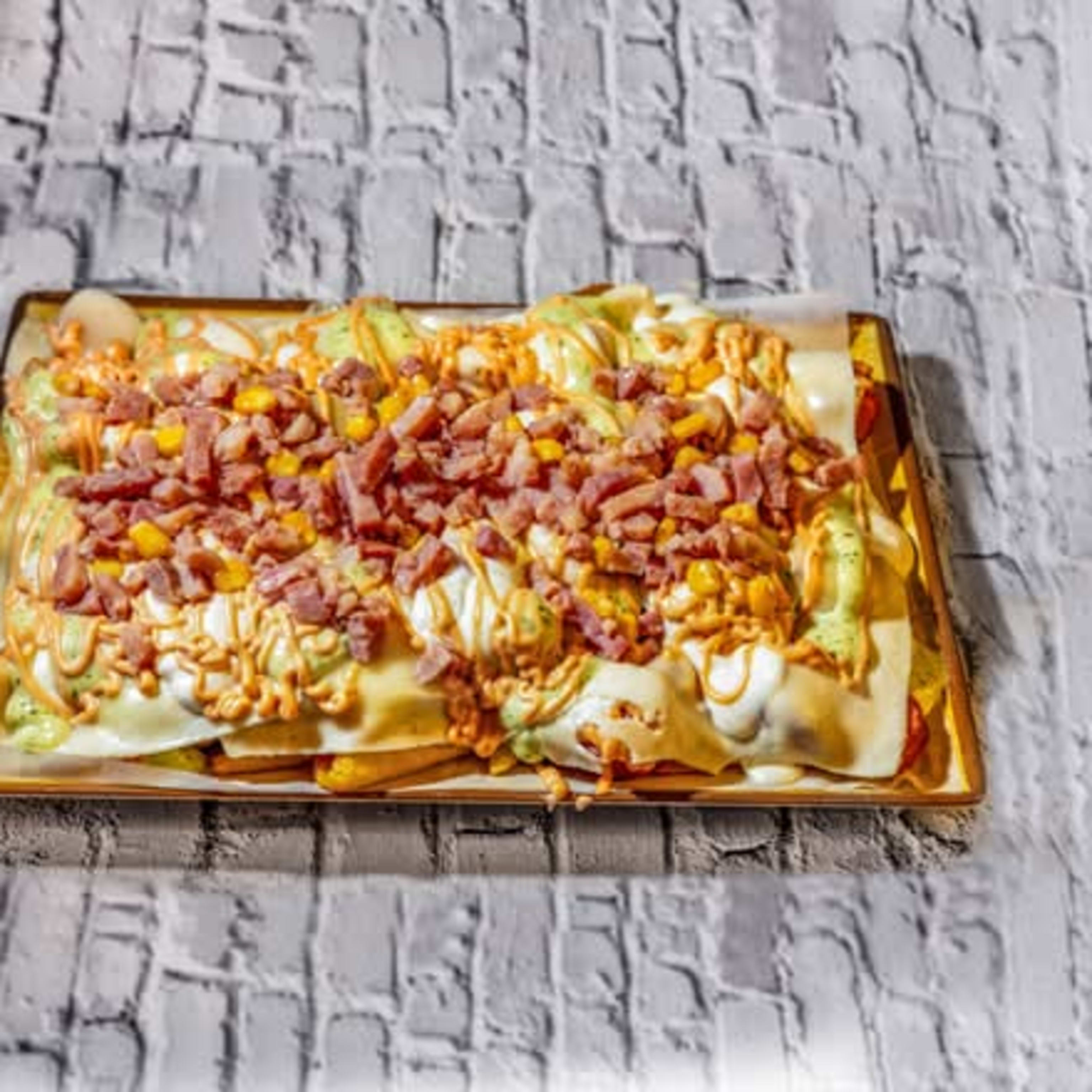 Salchipapa gratinada