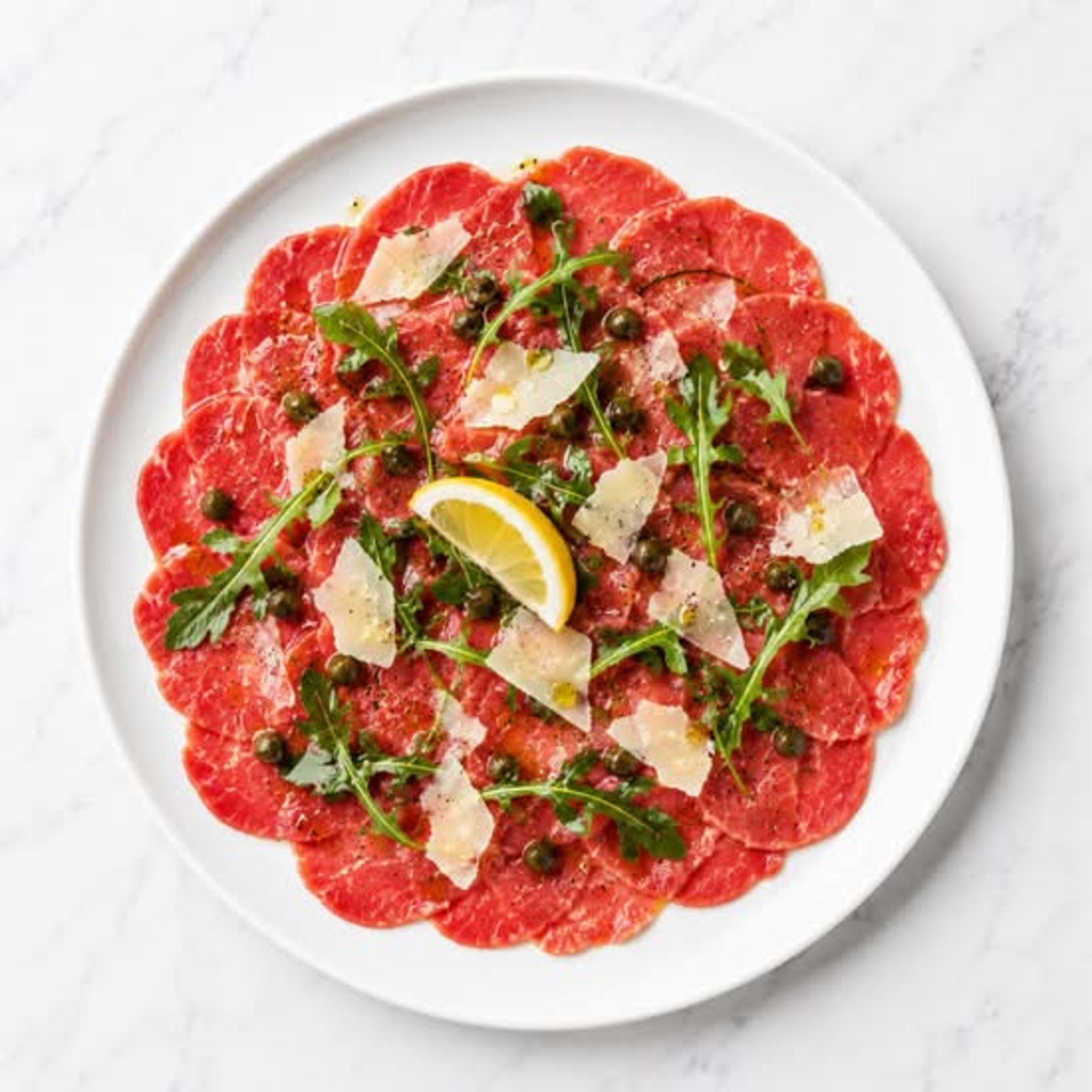 Antipasti Carpaccio di Manzo + BEBIDA