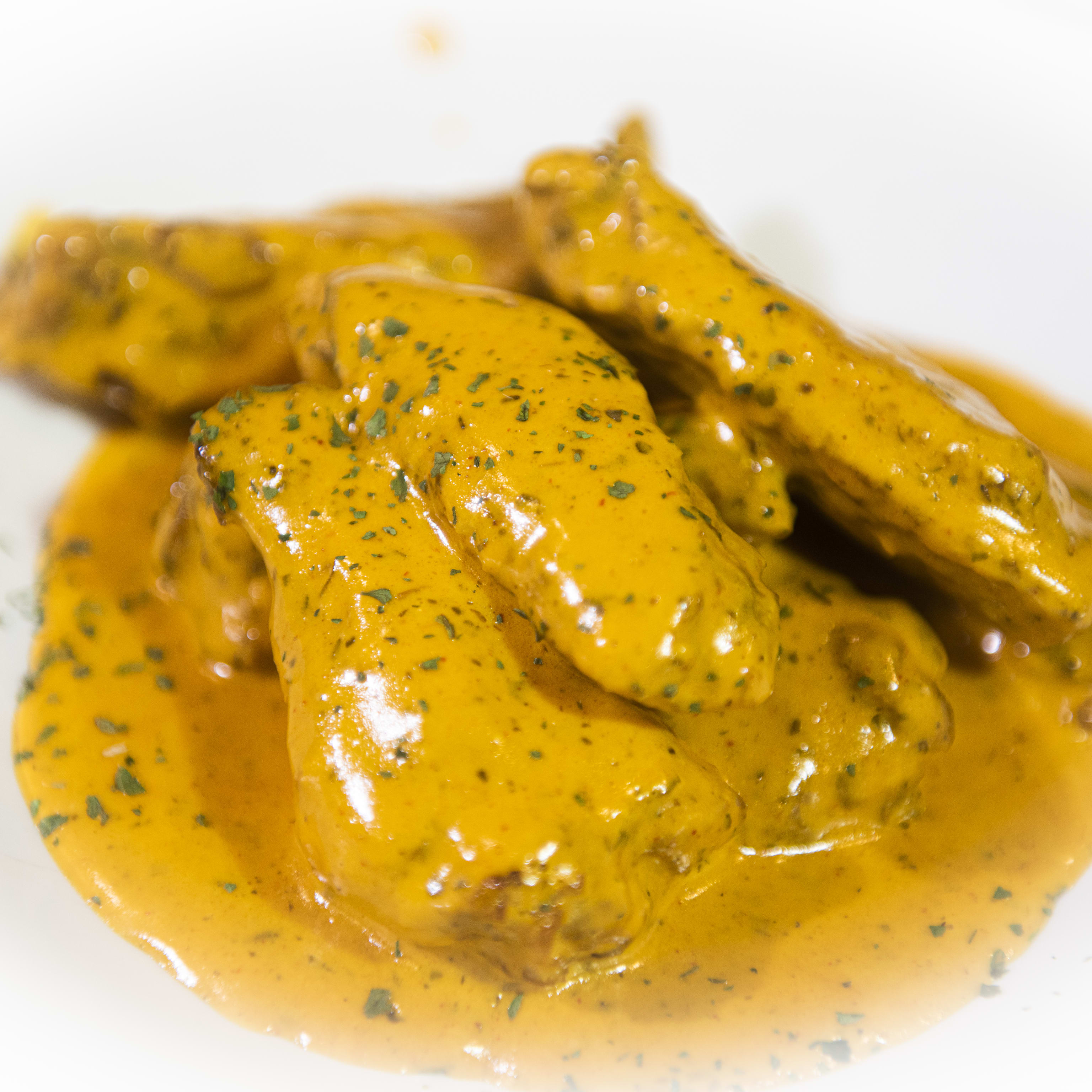12. Alitas en salsa de curry