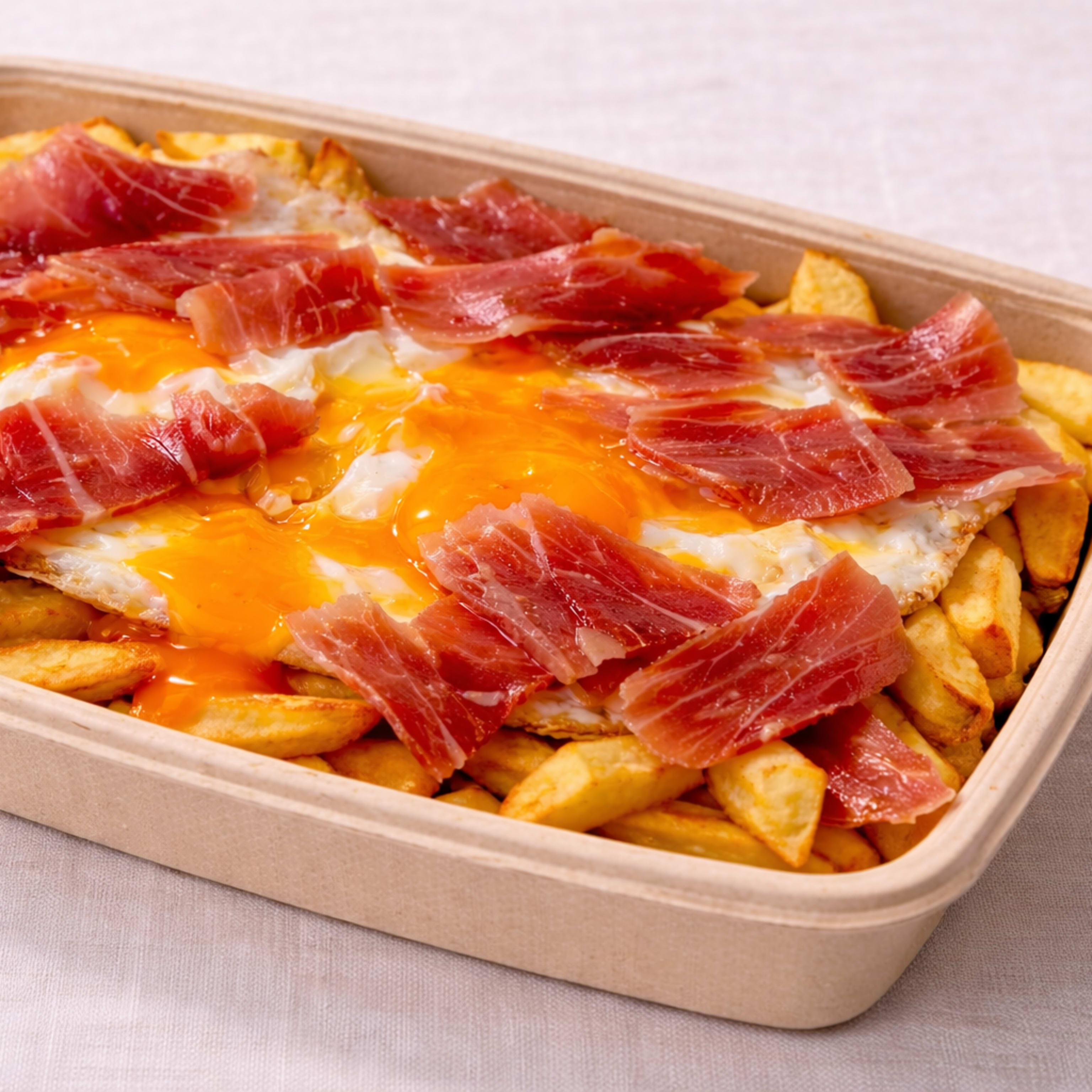 Huevos rotos con jamón