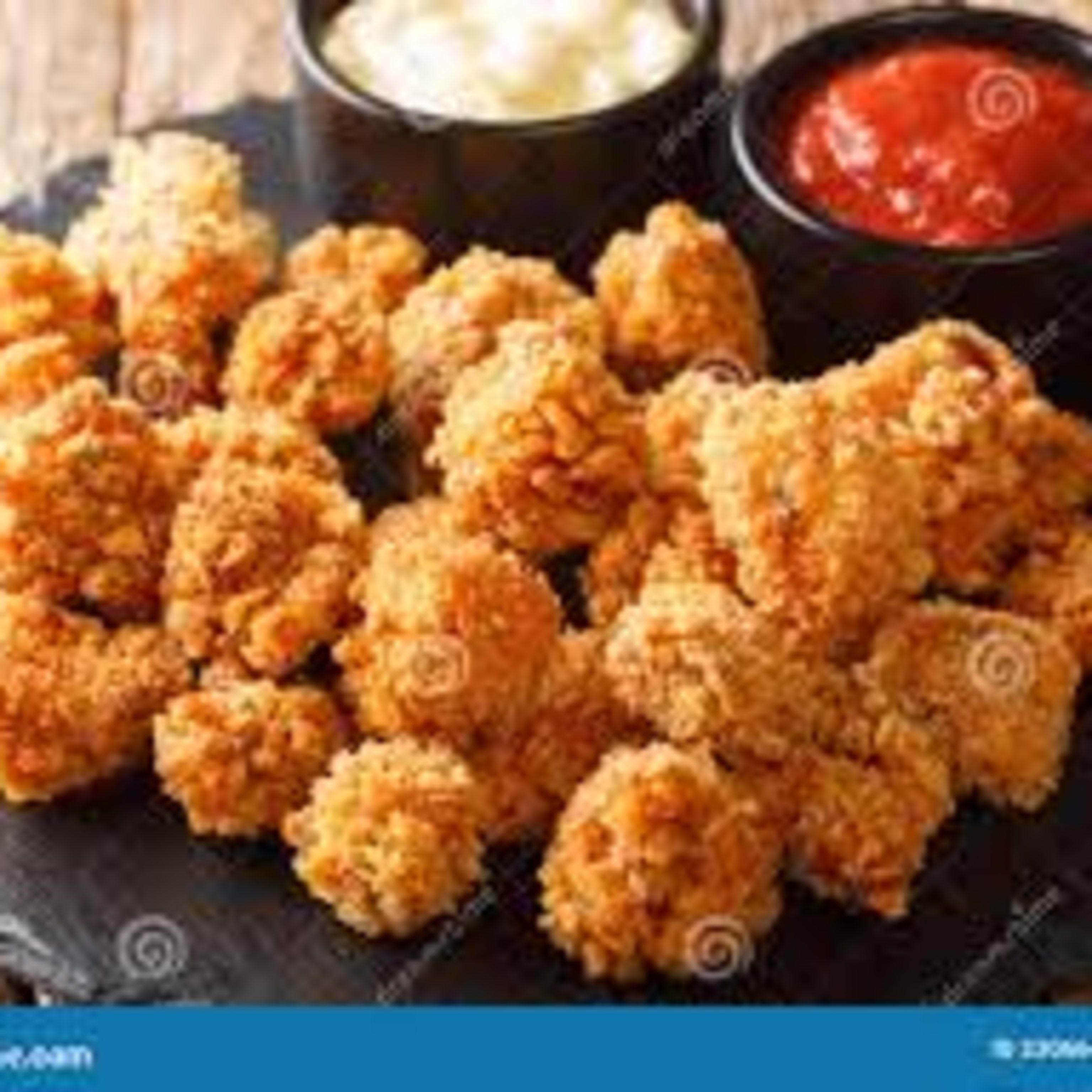 Pops (palomitas) de pollo rebozado picante