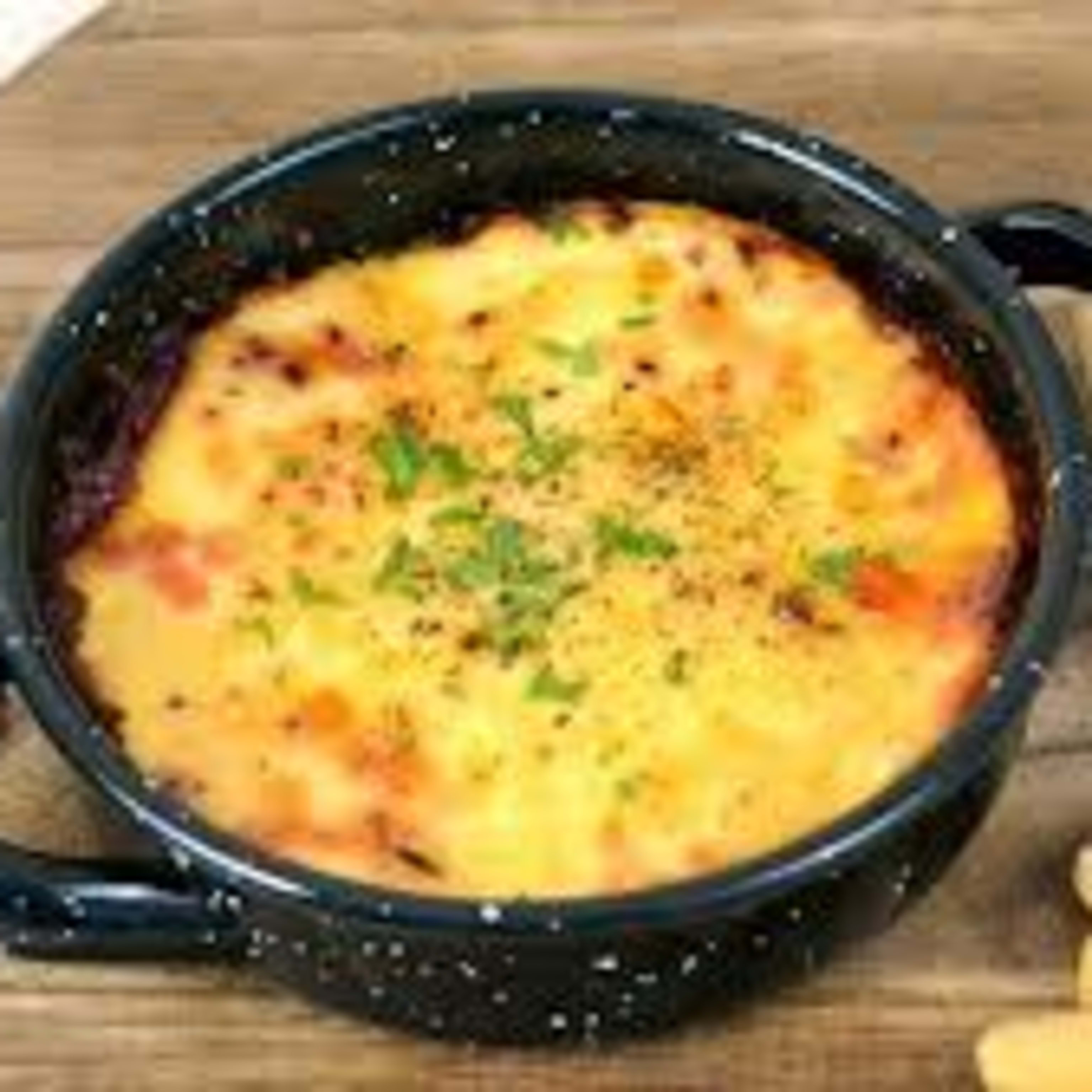 Queso provolone fundido al horno con picos para untar