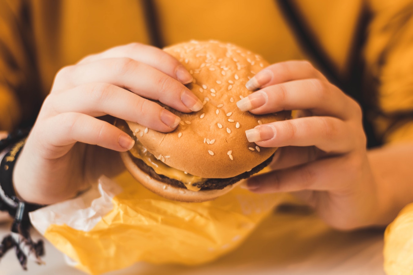 girl holding burger