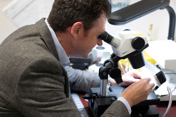 Gemologist looking at gemstones