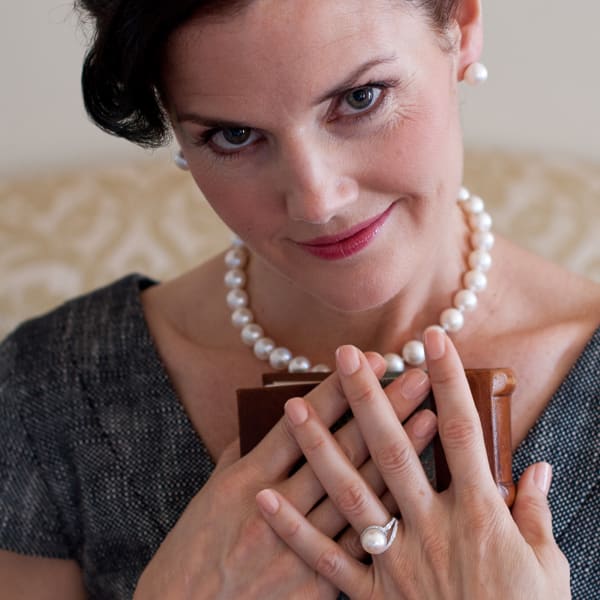Pearl earrings, ring and necklace.