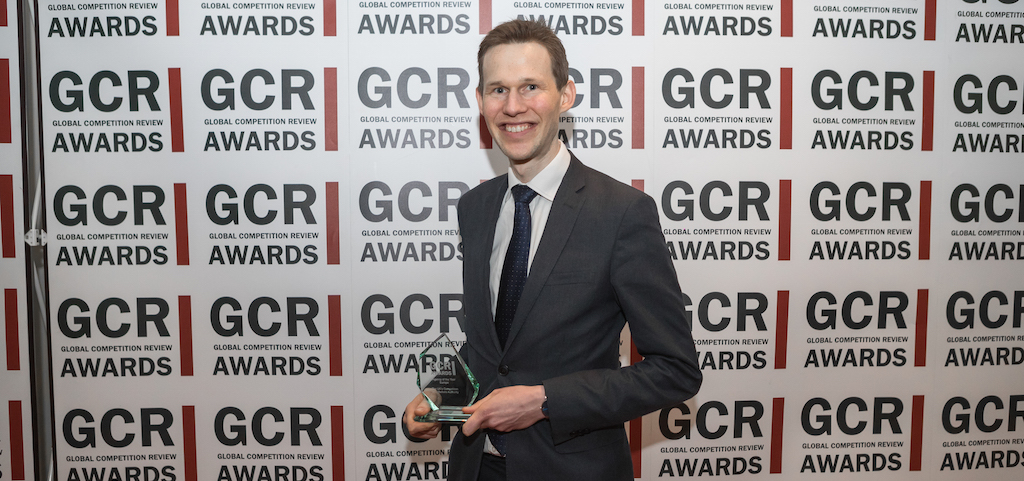 Simon Constantine from the Competition and Markets Authority collects the enforcer's award for Agency of the Year - Europe.