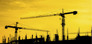 Construction/cranes (cropped) Former Louis Berger exec avoids prison after “game-changing” FCPA cooperation