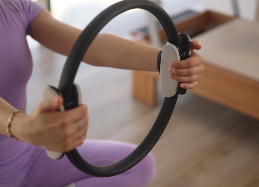Supportive Pilates instruction in a calm studio