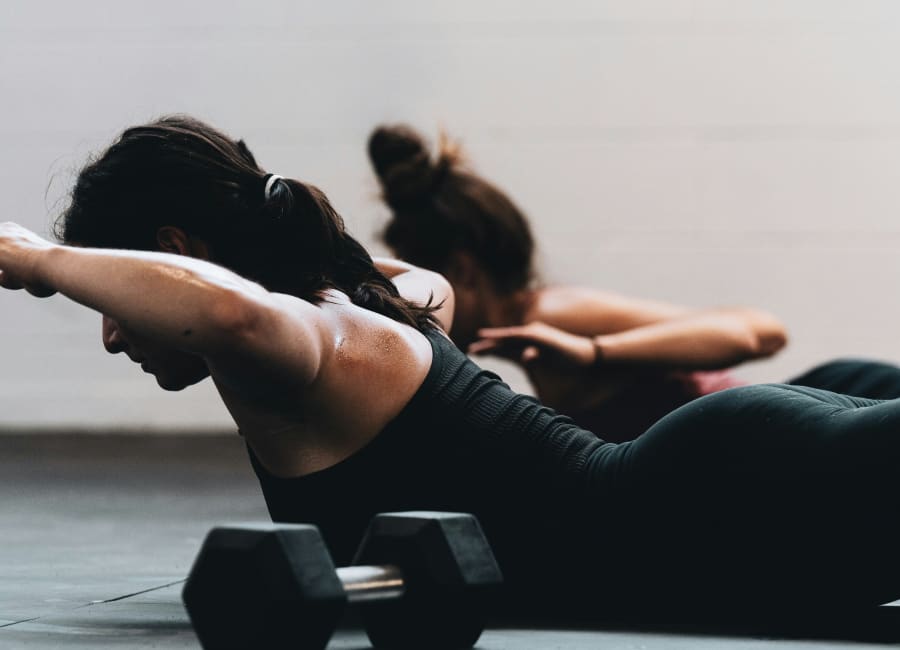 Pilates teacher providing attentive guidance