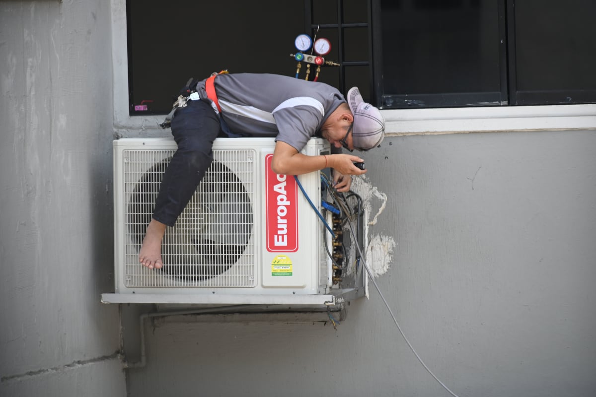 HVAC — Technician checks in at the site