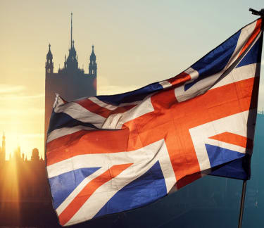 Union Jack flag and tower of London in the background