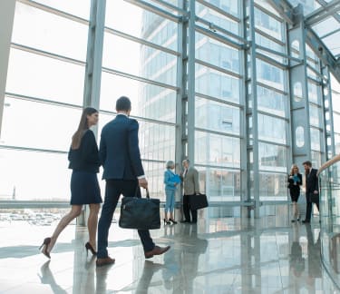 People walking in a building reception