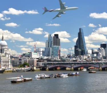 Plane flying in a city