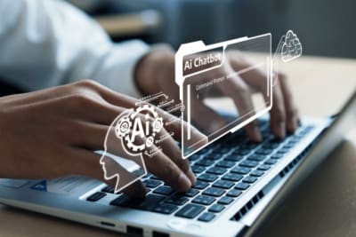 Person typing a laptiop and images showing AI