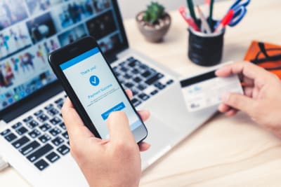 Person buying online paying with a credit card