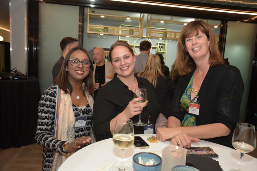 3 women at a networking event