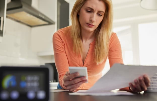 Woman looking at bills