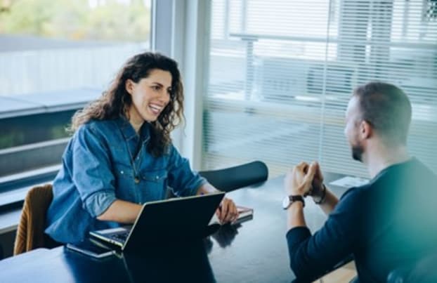 Woman and man talking in a meeting