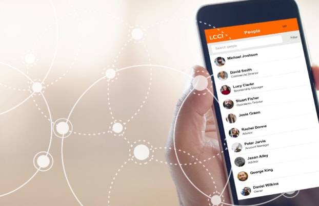 Hand holding an phone with LCCI App