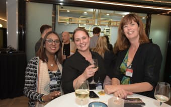 3 women at a networking event