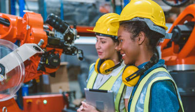 Two women working in a factory
