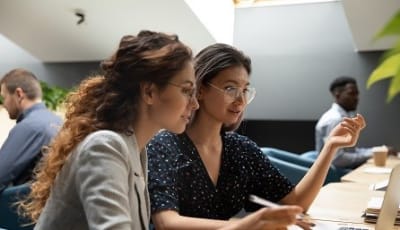 Two women working together