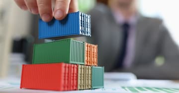 Man stacking containers models