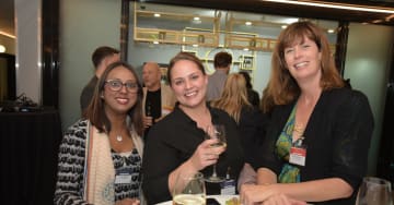 3 women at a networking event