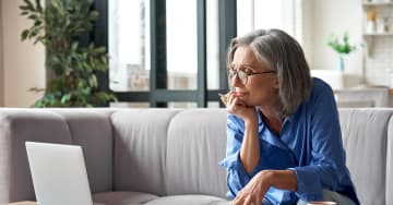Woman looking at a laptop while working